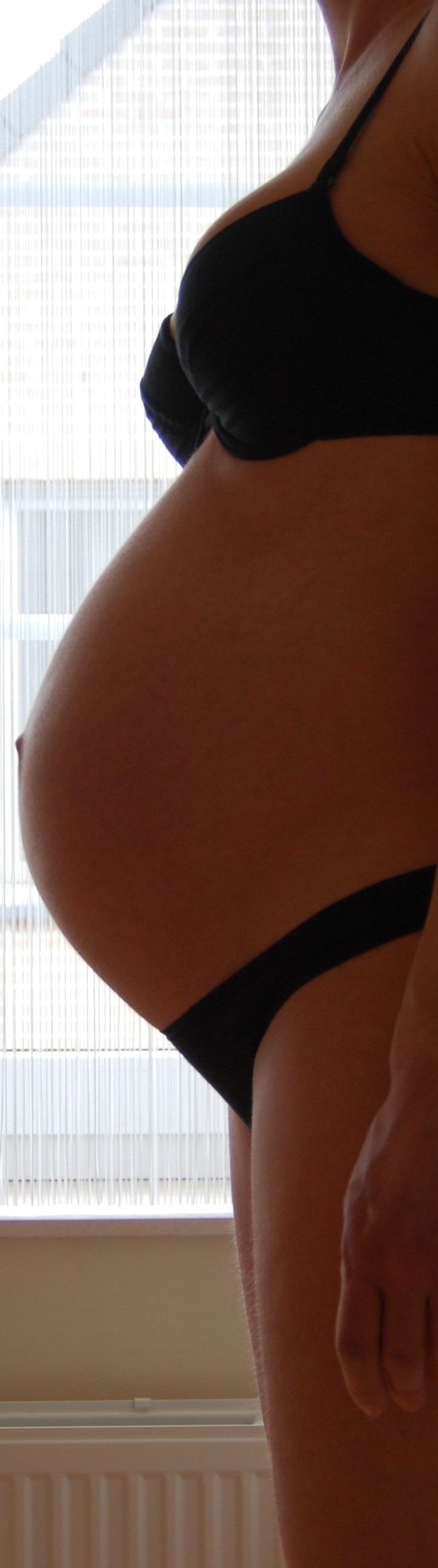 pregnant woman's belly hoping for a peaceful birth